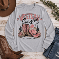 Western Cowgirl graphic long sleeve crewneck tee with pink boots, cowboy hat and desert design