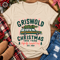 Christmas graphic tee featuring Griswold Christmas Tree Farm vintage green station wagon with Christmas tree and retro lettering.