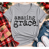 A heather gray V-neck t-shirt with the words 'amazing grace.' printed in a distressed black typewriter font.