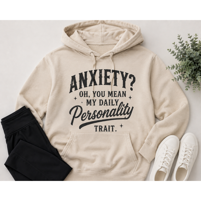 Cream hoodie with black vintage-style lettering reading Anxiety? Oh, You Mean My Daily Personality Trait.