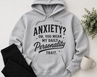Grey hoodie with black vintage-style lettering reading Anxiety? Oh, You Mean My Daily Personality Trait.