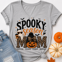 Grey Spooky Season Mom graphic tee featuring leopard print lettering, coffee ghost, jack-o'-lantern pumpkin, bats and Coffee Chaos Candy Repeat text.