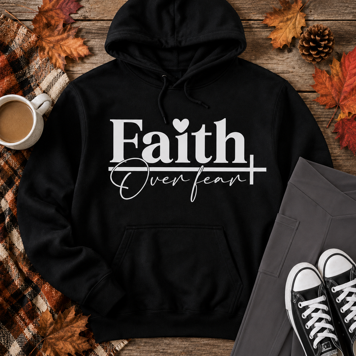 Julia Rose Faith Over Fear apparel featuring a white heart and cross design, available as a crewneck, V-neck, long-sleeve T-shirt and hoodie.