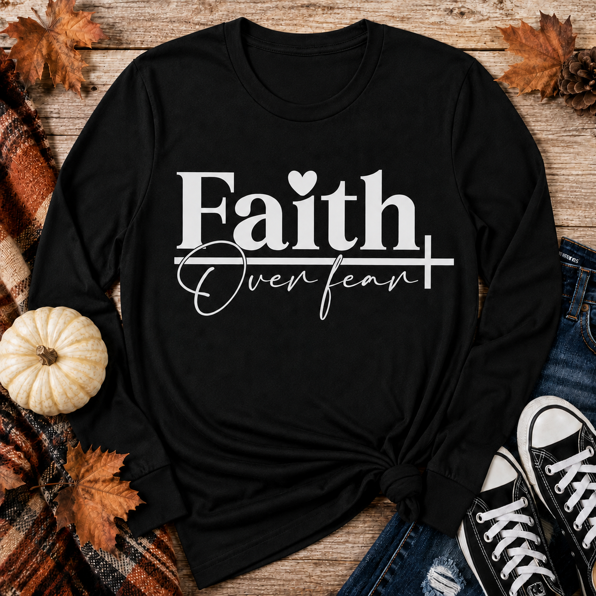 Julia Rose Faith Over Fear apparel featuring a white heart and cross design, available as a crewneck, V-neck, long-sleeve T-shirt and hoodie.