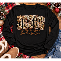 Jesus Is the Reason for the Season Christmas graphic shirt featuring bold leopard print JESUS lettering, decorative gold bows, and gold script. Faith-inspired holiday apparel available in red and black with four style options.