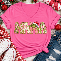 Christmas MAMA graphic shirt featuring pink and green patterned lettering, colorful holiday lights, and a Grinch-inspired character wearing a Santa hat.