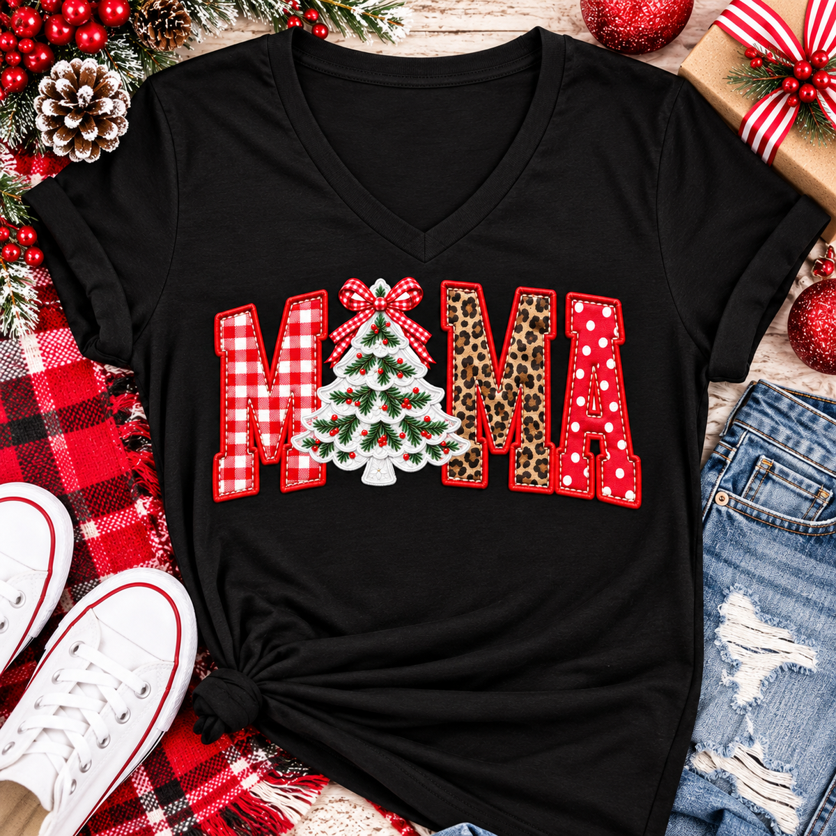 Festive MAMA Christmas graphic apparel featuring bold red gingham, leopard print and red polka dot lettering with a decorated Christmas tree and gingham bow replacing the first A, available in black and red in short sleeve crewneck, V-neck, long sleeve crewneck sweatshirt and hoodie styles.