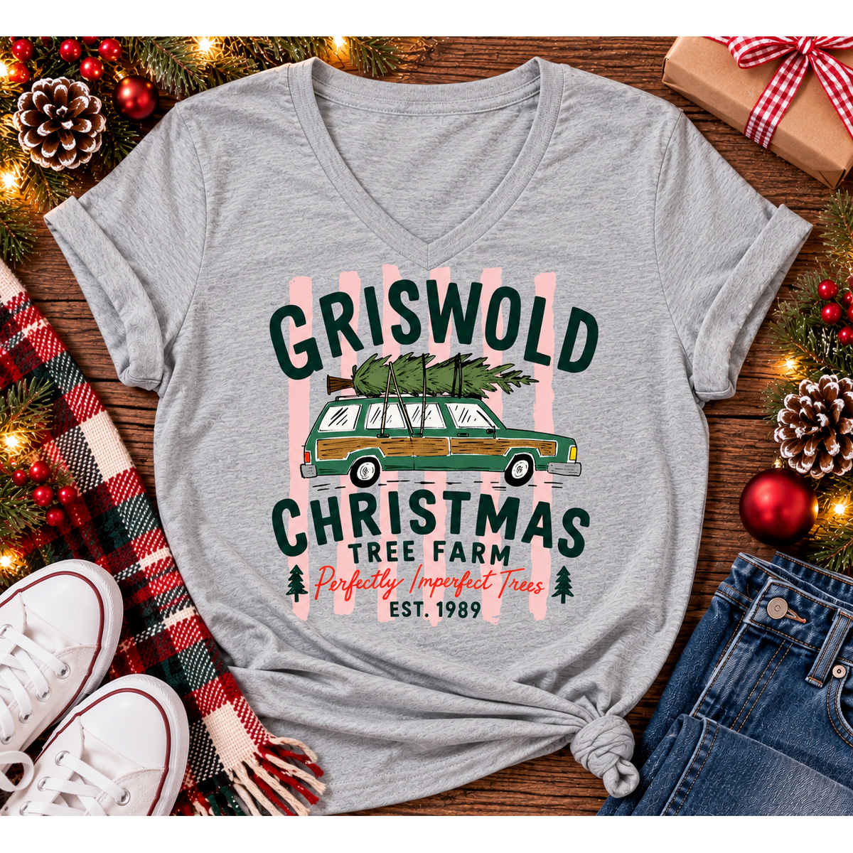 Christmas graphic tee featuring Griswold Christmas Tree Farm vintage green station wagon with Christmas tree and retro lettering.