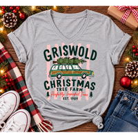 Christmas graphic tee featuring Griswold Christmas Tree Farm vintage green station wagon with Christmas tree and retro lettering.