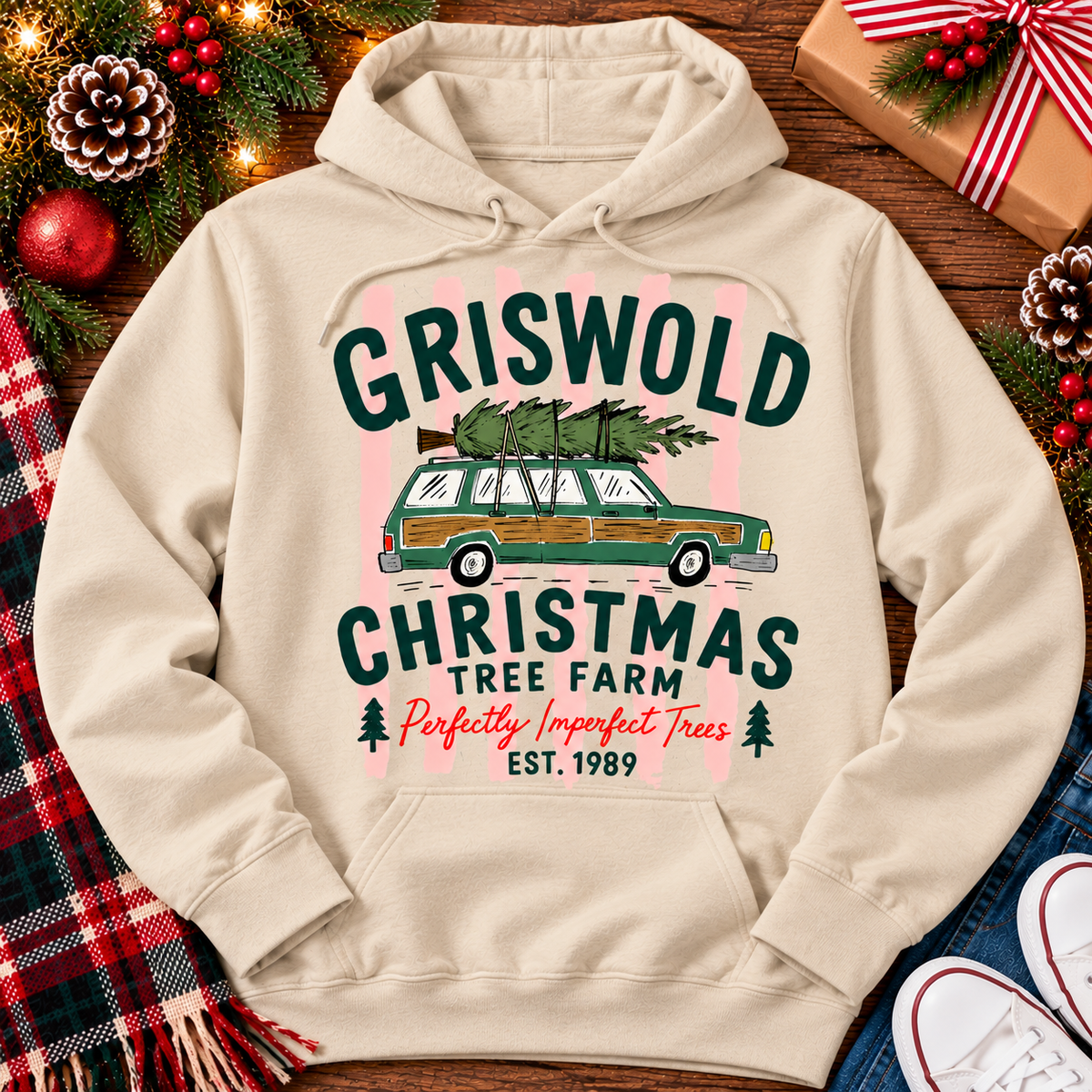 Christmas graphic tee featuring Griswold Christmas Tree Farm vintage green station wagon with Christmas tree and retro lettering.