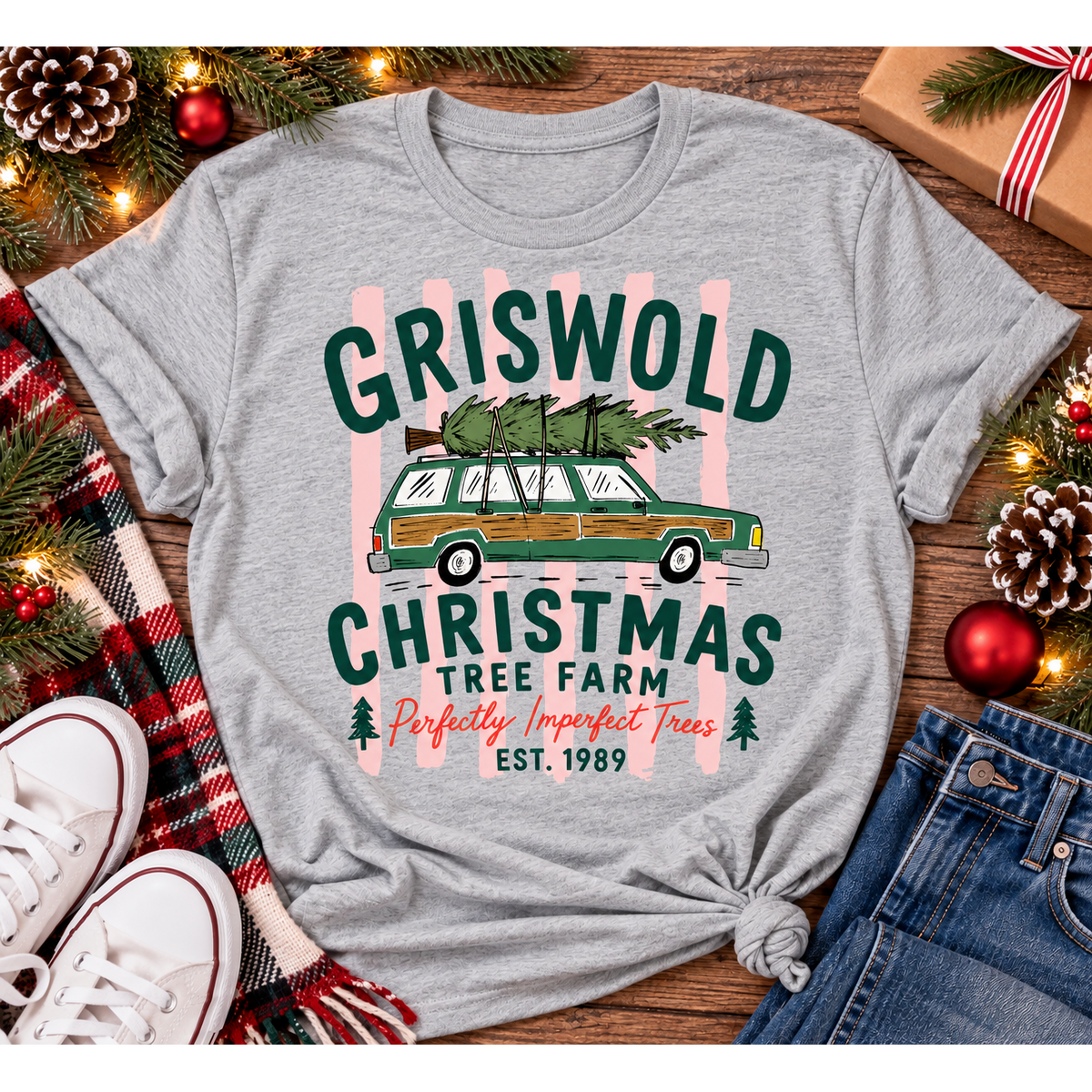 Christmas graphic tee featuring Griswold Christmas Tree Farm vintage green station wagon with Christmas tree and retro lettering.