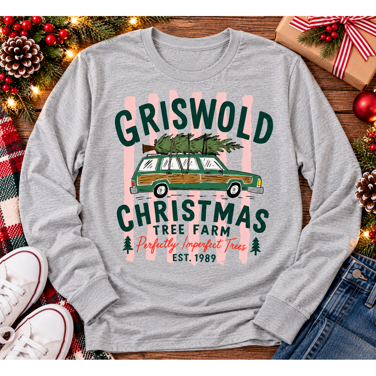 Christmas graphic tee featuring Griswold Christmas Tree Farm vintage green station wagon with Christmas tree and retro lettering.