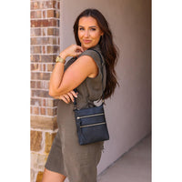 Envelope style crossbody bag with multiple zipper compartments