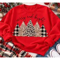 Merry and Bright Christmas graphic apparel featuring leopard print, buffalo plaid and glitter-inspired gold Christmas trees, available in three colors and four styles including crewneck tee, V-neck tee, sweatshirt and hoodie.
