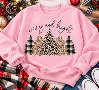 Merry and Bright Christmas graphic apparel featuring leopard print, buffalo plaid and glitter-inspired gold Christmas trees, available in three colors and four styles including crewneck tee, V-neck tee, sweatshirt and hoodie.