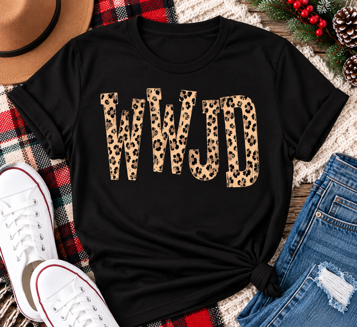 shirt with tan leopard-print WWJD lettering in a rustic holiday flat lay.