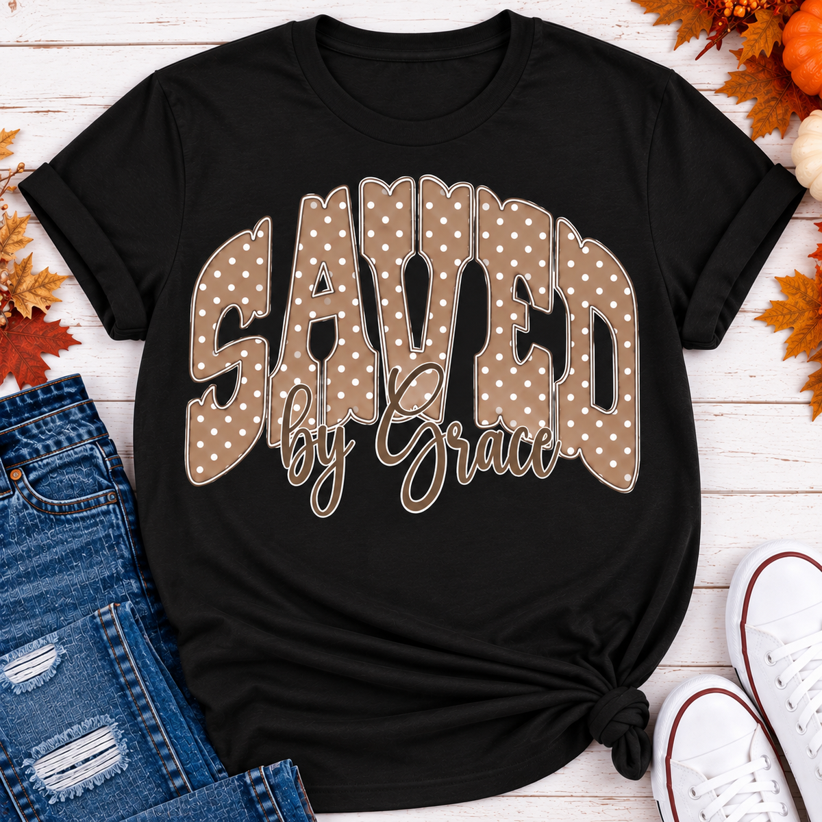 Saved by Grace faith graphic apparel with polka dot lettering, available in brown, navy and black V-neck, long sleeve, crewneck and hoodie styles.