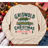 Christmas graphic tee featuring Griswold Christmas Tree Farm vintage green station wagon with Christmas tree and retro lettering.