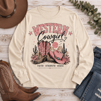 Western Cowgirl graphic long sleeve crewneck tee with pink boots, cowboy hat and desert design