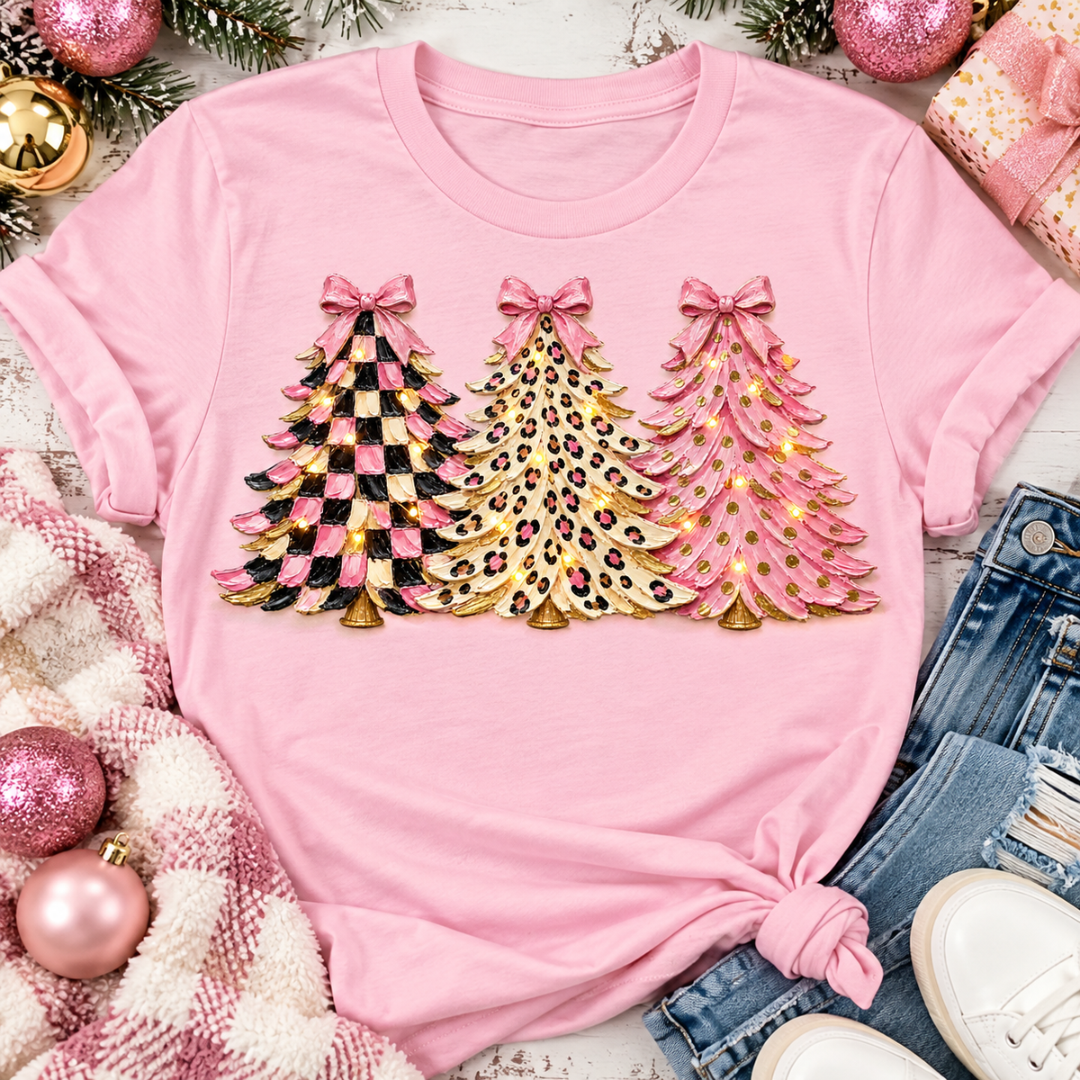 Pink leopard and checkered Christmas trees graphic apparel for women in pink and black