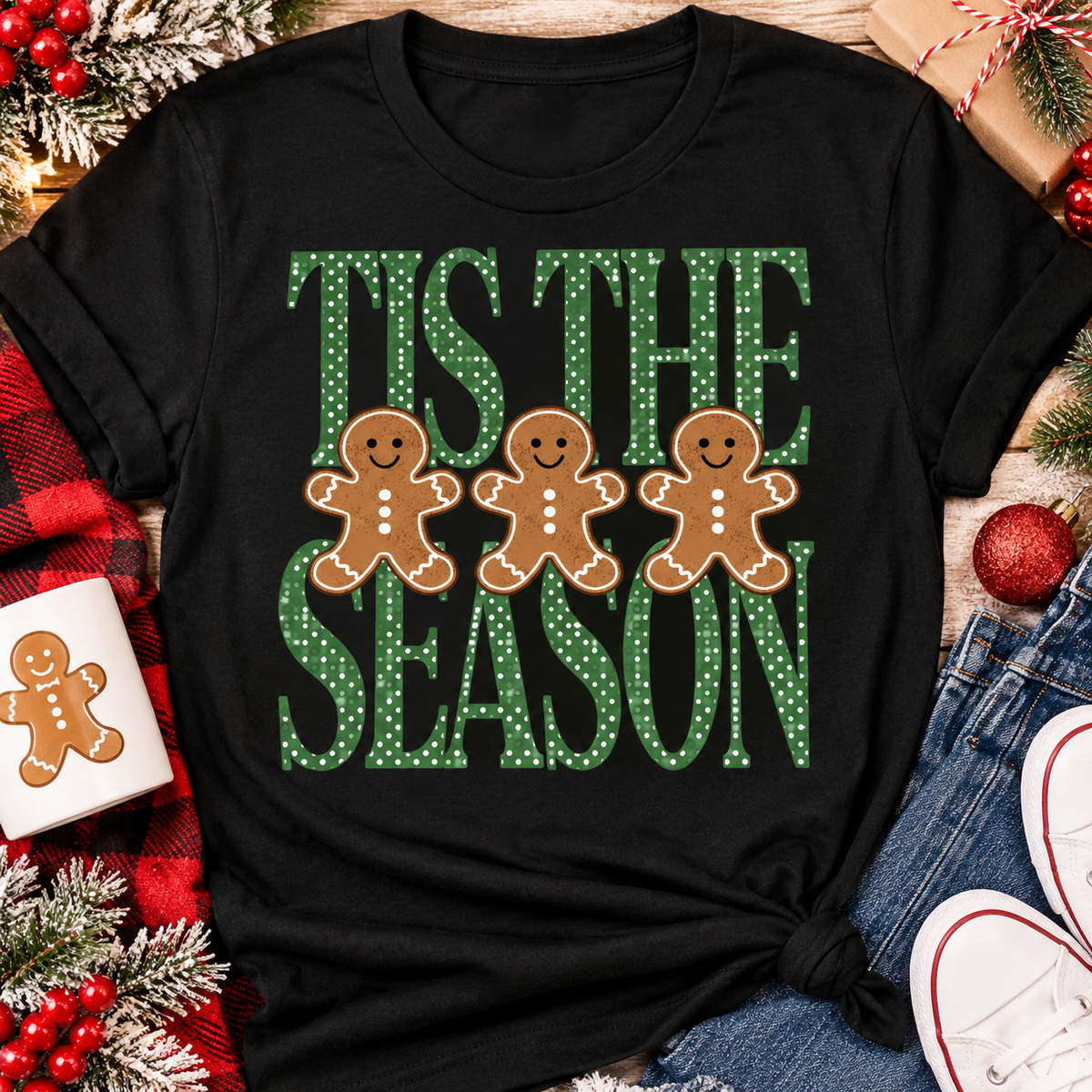 Tis the Season Christmas graphic apparel featuring green polka dot lettering and three gingerbread cookies