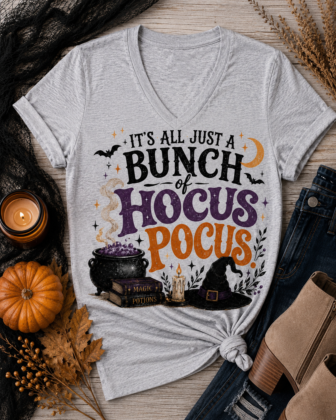 Gray Halloween graphic tee with It’s All Just a Bunch of Hocus Pocus lettering, cauldron, spell books, witch hat and bats.