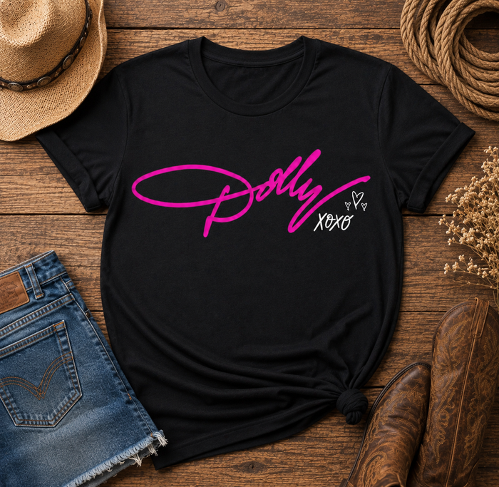 Black Dolly tribute graphic T-shirt featuring bright pink Dolly script with white XOXO and heart details.