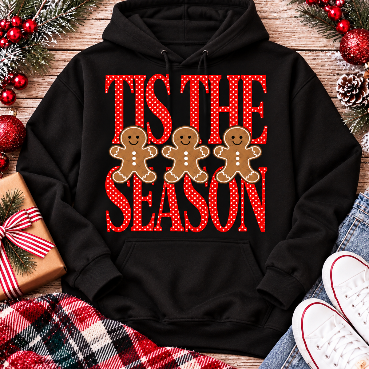 Tis the Season Christmas graphic apparel featuring red polka dot lettering and three gingerbread cookies
